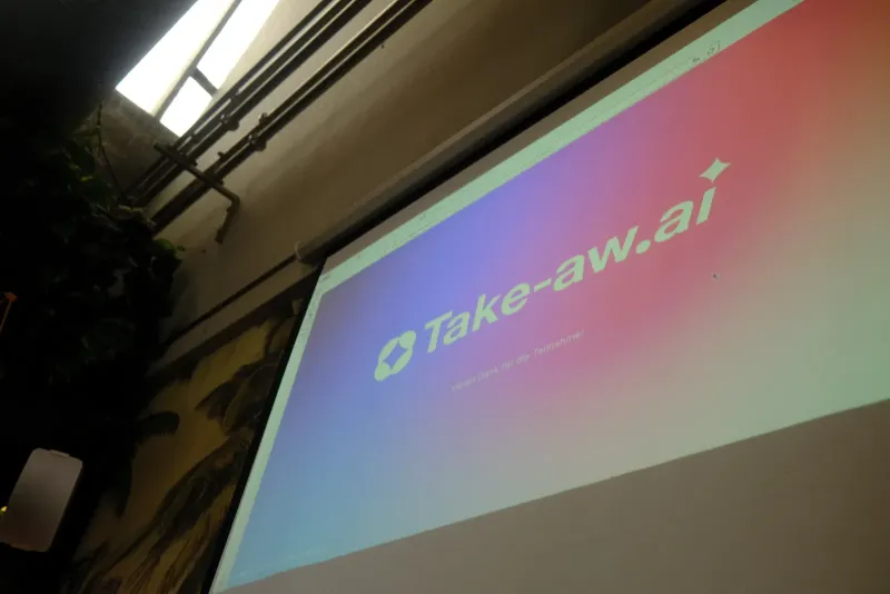 Take-Aw.ai session screen projected in a room with a thank-you message